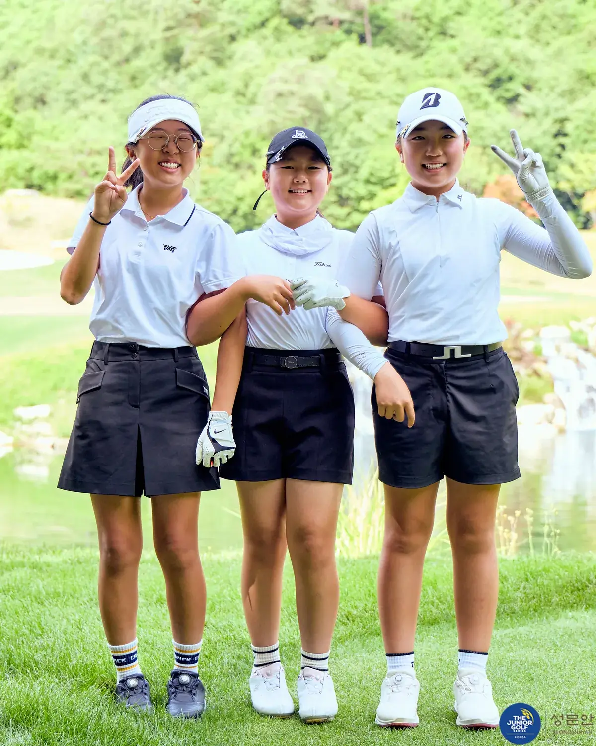 Two players shaking hands on the final green